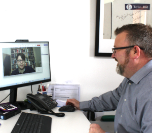 Richard Taylor assists a client via the latest technology, Zoom.